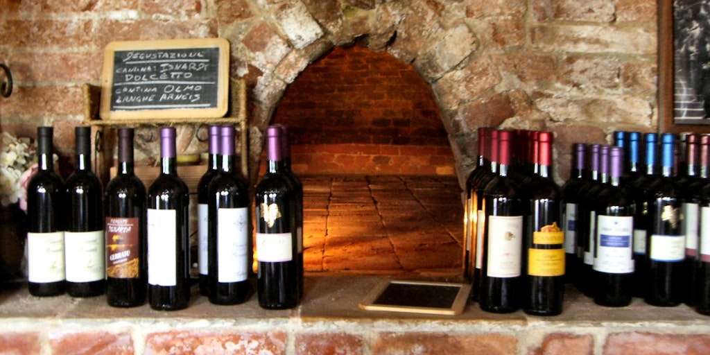 Wine in front of the ancient stone oven