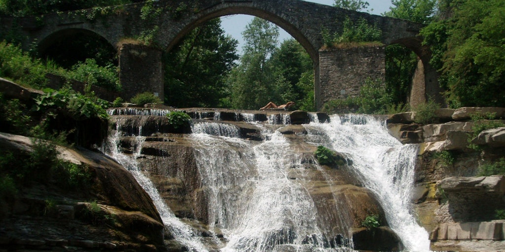 The ancient Brusia bridge with waterfall