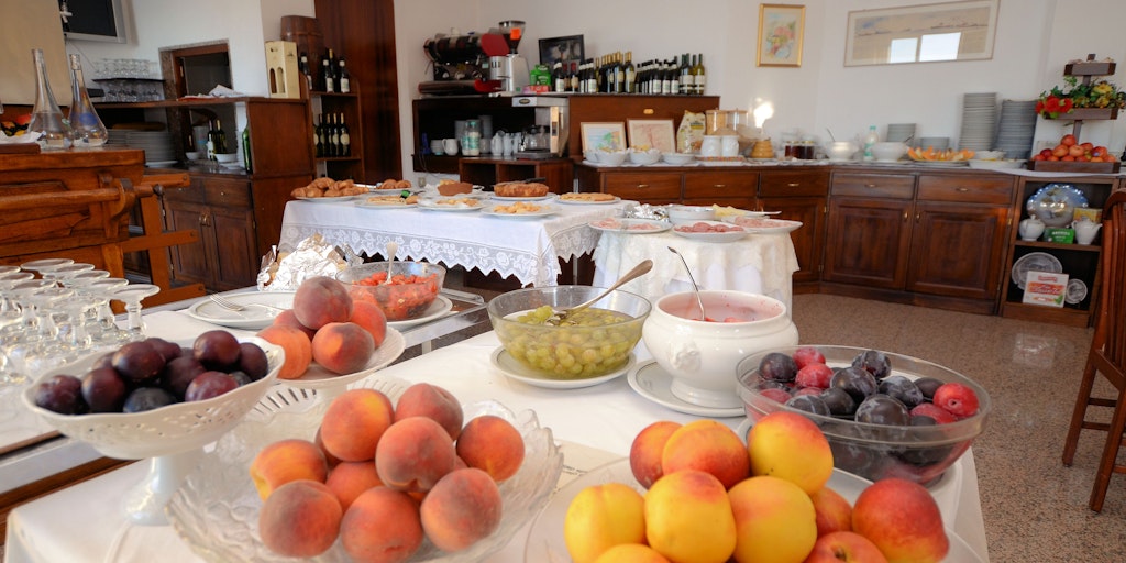 Breakfast buffet with fruit, homemade cakes, etc.