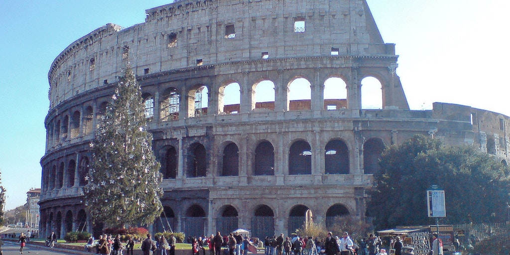 Colosseum and the Christmas tree in sunny weather